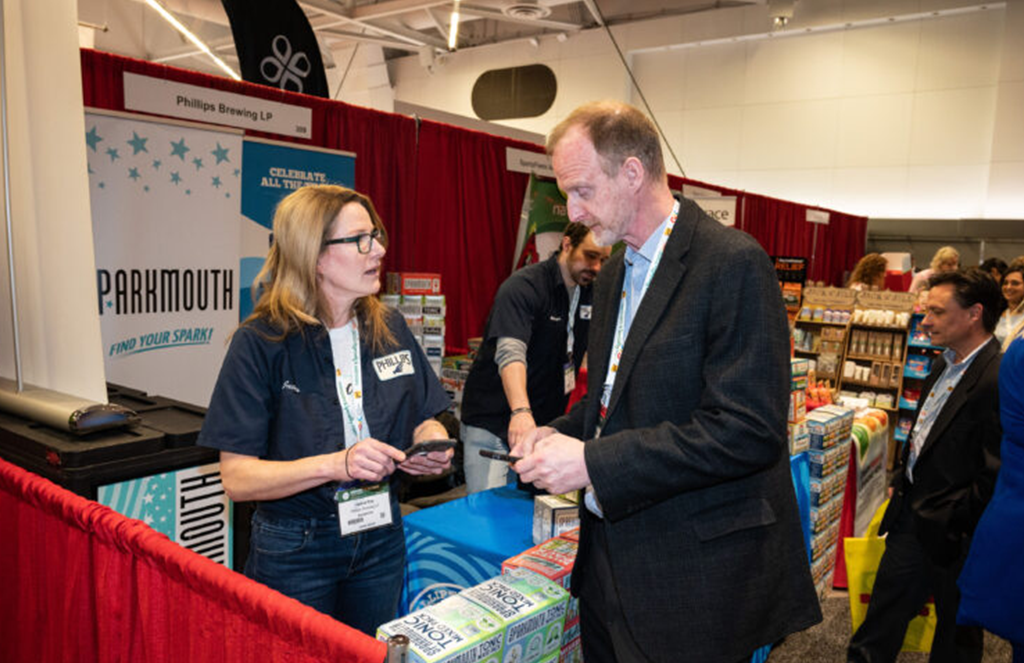 Supplier discussing products with an attendee at GSF