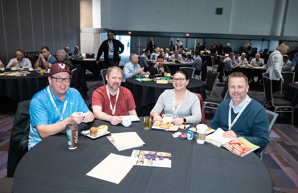 Grocery professionals networking around a table at GSF